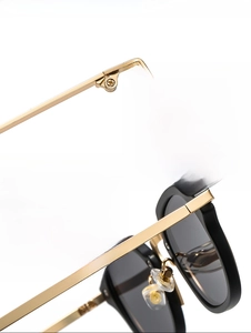 Detail of premium metal hinge and thick square frame on vintage punk sunglasses