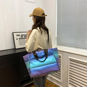Rear view of a model carrying a large gradient purple yoga bag with quilted texture