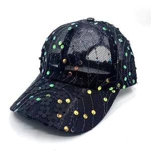 Detail of black mesh baseball cap with iridescent sequins and 3D floral decorations