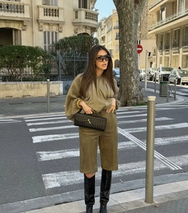 Street style shot of olive green suede bermuda shorts and matching long sleeve top
