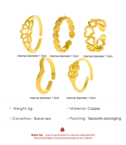 Detail of 5-piece gold-toned copper ring set showing lotus and heart designs with measurements
