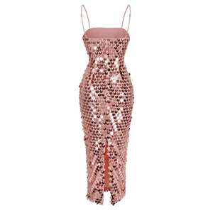 Detailed view of pink sequin fabric and back slit on an elegant fitted evening gown