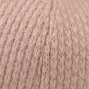 Macro texture of warm brown plaid knit fabric with subtle gold metallic thread detail
