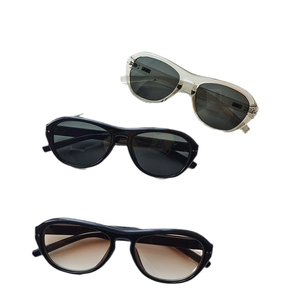 Vintage oversized oval frame sunglasses set in dark grey, transparent grey, and brown tints