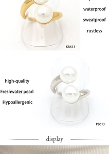 Detail of waterproof stainless steel open rings with elegant freshwater pearls