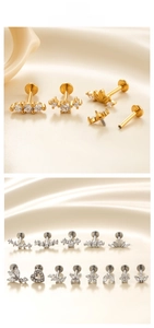 Detailed macro of stainless steel stud earrings with zirconia flowers and butterflies