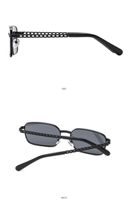 Detail view of black square sunglasses featuring a unique side chain temple design