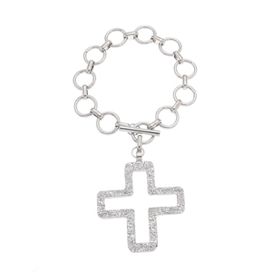Detail of silver textured cross pendant and chunky interlocking chain link bracelet