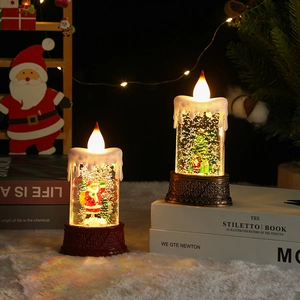 Close-up of LED Christmas lanterns with Santa and tree motifs in a cozy holiday setting