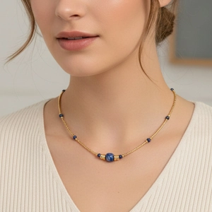 Close-up of bohemian blue sodalite beads on a minimalist gold plated necklace for women