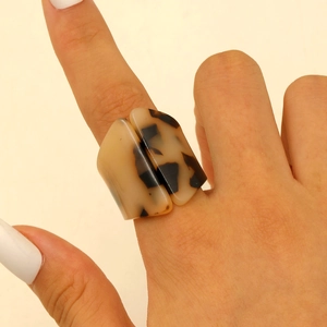 Close-up of geometric thick acrylic ring with classic leopard tortoise shell pattern