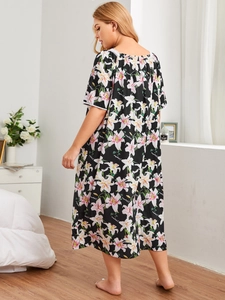 Detailed back view of plus size nightgown featuring floral print and delicate lace trim