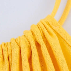 Yellow smocked maxi dress in linen-like fabric with delicate tie shoulder straps