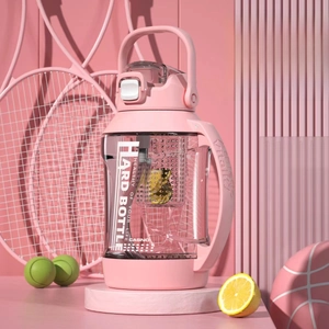 Close-up of pink sports water bottle with tea infuser filter and carry handle detail