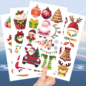 Waterproof Christmas temporary tattoo set for kids featuring Santa and Reindeer motifs