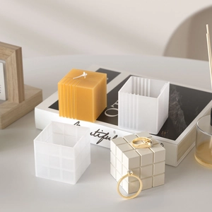 Cube silicone mold set for candles showing grid and vertical textures with finished wax product
