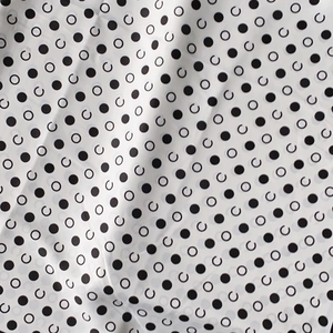 Polka dot silk-like scarf with black circles on white fabric for elegant women