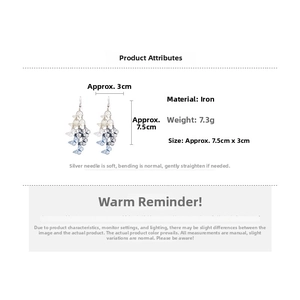 Detail view showing blue and white butterfly tassel earrings with 7.5cm drop length