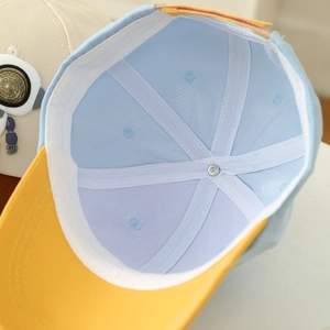 Detail of boys baseball cap interior featuring breathable mesh lining and sweatband