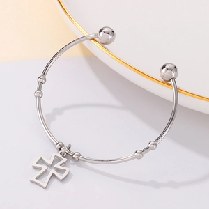 Detailed view of silver stainless steel cuff bracelet with hollow cross and beads