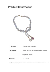 Detail view of crystal bow necklace showing dimensions 34.1cm plus 5.6cm extender chain