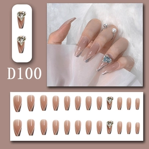Detail of long coffin press-on nails with 3D heart rhinestones and silver glitter tips