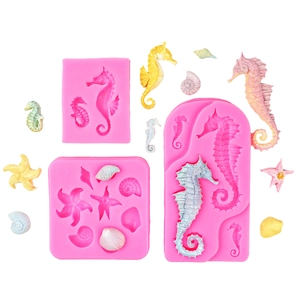 Pink silicone fondant molds for ocean-themed sea horse, starfish, and shell cake toppers