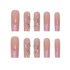 Long coffin press-on nails with pink glitter French tips and rhinestone heart designs