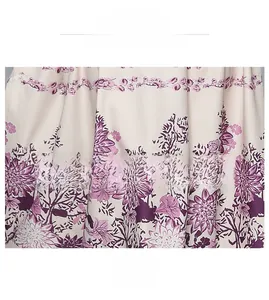 Quality floral print fabric detail showing soft purple flower patterns on beige textile