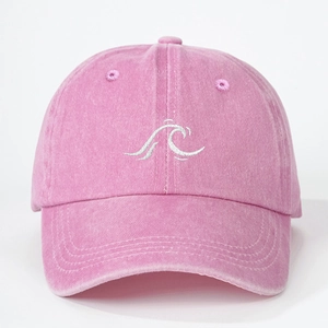 Vintage washed pink baseball cap with white wave embroidery and adjustable strap