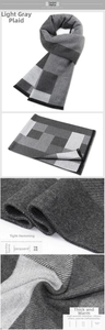 Detail of light grey plaid scarf featuring jacquard texture and tight hem stitching