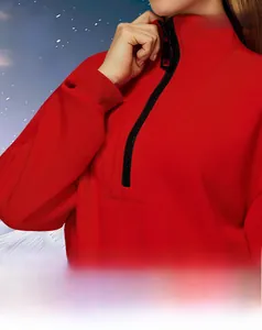 Detailed view of red windproof quarter-zip sweatshirt featuring thick thermal fabric
