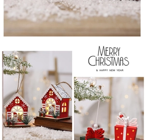 Detail of glowing wooden Christmas house ornament with warm LED light and Santa motifs
