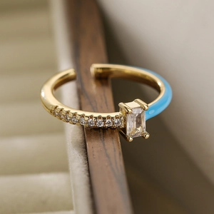 Detail of 18K gold-plated ring with blue enamel, rectangle zircon and micro-inlaid stones