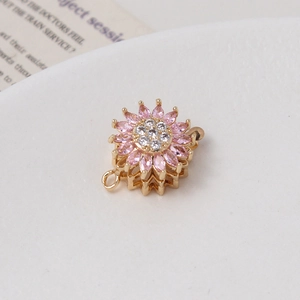 Detail of sunflower clasp with pink and white cubic zirconia for jewelry making