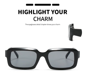 Close-up of black square sunglasses with wide temples and polished acetate texture