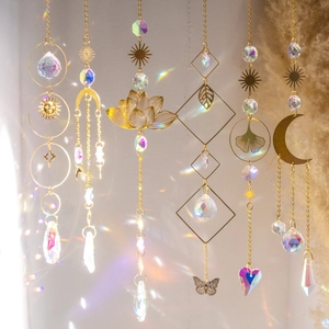 Detailed view of multiple crystal suncatchers casting vibrant rainbow prisms on a wall