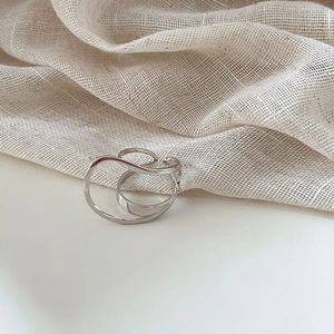 Minimalist silver double-layered open ring with irregular geometric polished metal design