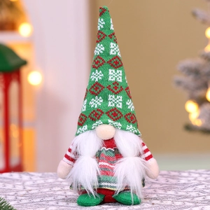 Close-up of a festive Christmas gnome with a green knit snowflake hat and plush white beard