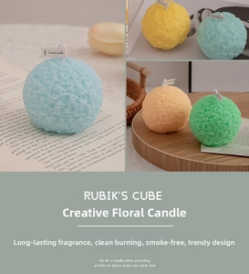 Detailed macro view of colorful rose ball scented candles with embossed flower texture