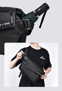 Detail showing the internal storage capacity for an umbrella in a black cross-body bag
