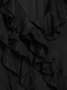 Detail of ruffled black chiffon neckline with elegant tiered layers and silky texture
