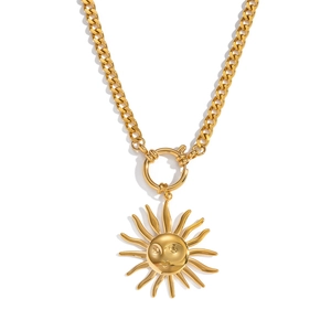Vintage sun face pendant necklace with gold cuban chain on a clean white background