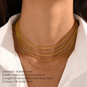 Snake chain necklaces in gold and silver, showing various widths and lengths on a model