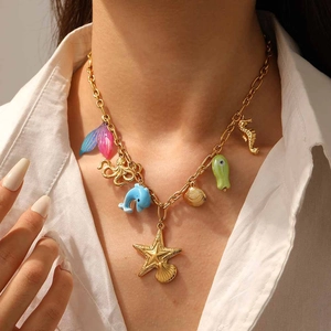 Gold-plated marine necklace with colorful starfish, seahorse, and shell pendants