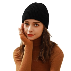 Classic black knitted beanie for women featuring a fine ribbed texture for winter warmth