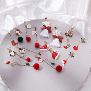Asymmetric Christmas earrings set featuring reindeer, snowman and gingerbread man designs
