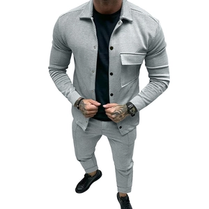 Detailed view of men's grey casual tracksuit featuring distinct twill fabric texture