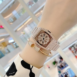 Rose gold tonneau watch with rotating diamond dial and matching luxury bracelet set
