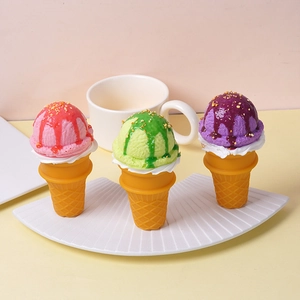 Three realistic PU artificial ice cream cones in pink, green and purple on a white tray